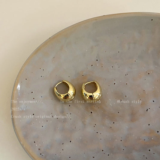 Golden metal earrings